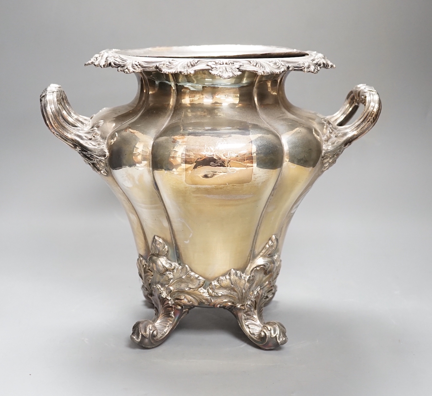 A William IV Old Sheffield plate twin handled wine cooler, with liner, acanthus scrolled borders, on four scrolled feet Height 28cm